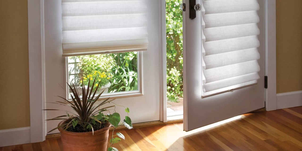 Hunter Douglas Vignette® Roman Shades covering a French door near Youngstown, OH